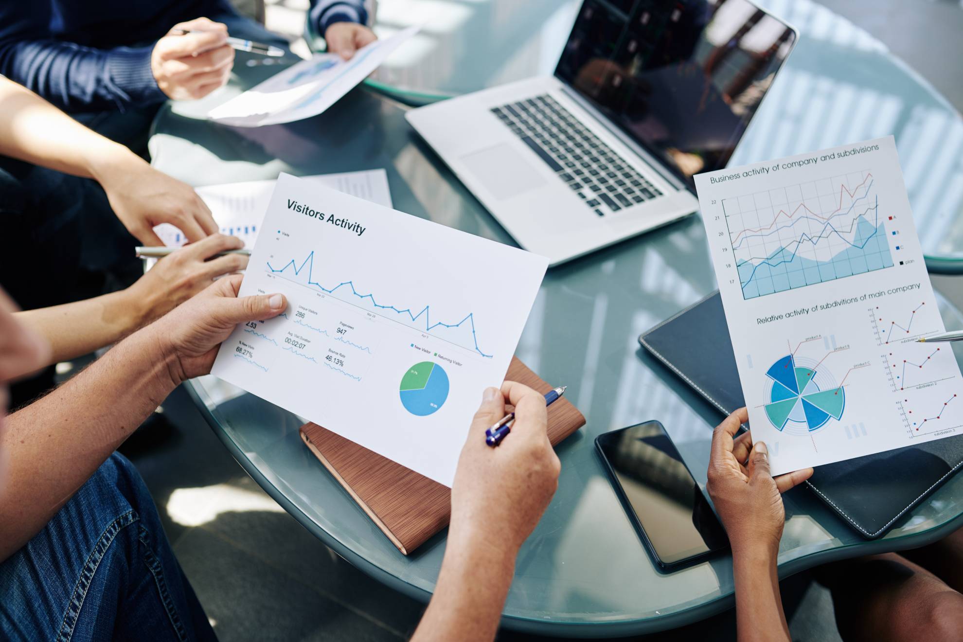 business-people-analyzing-financial-documents-udgs64t-1.[1]